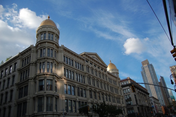 The O'Neill and Company department store opened in 1887, and was in business until 1907.  Over the next century, the building served a number of purposes, and in 2006, at the height of real estate bubble, the gold domes were restored and the huge complex went residential.  In late 2012, there was a minor structural collapse, which, I imagine, is still being resolved. 
